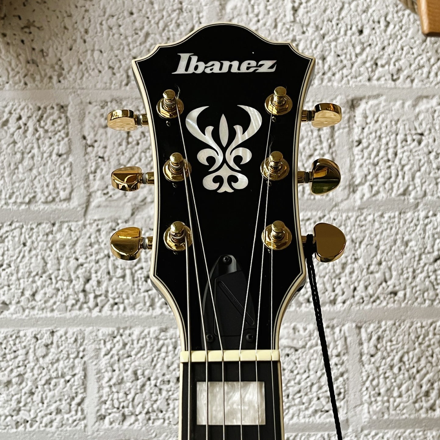 ibanez as93fm transparent moss green semi-hollow electric guitar headstock