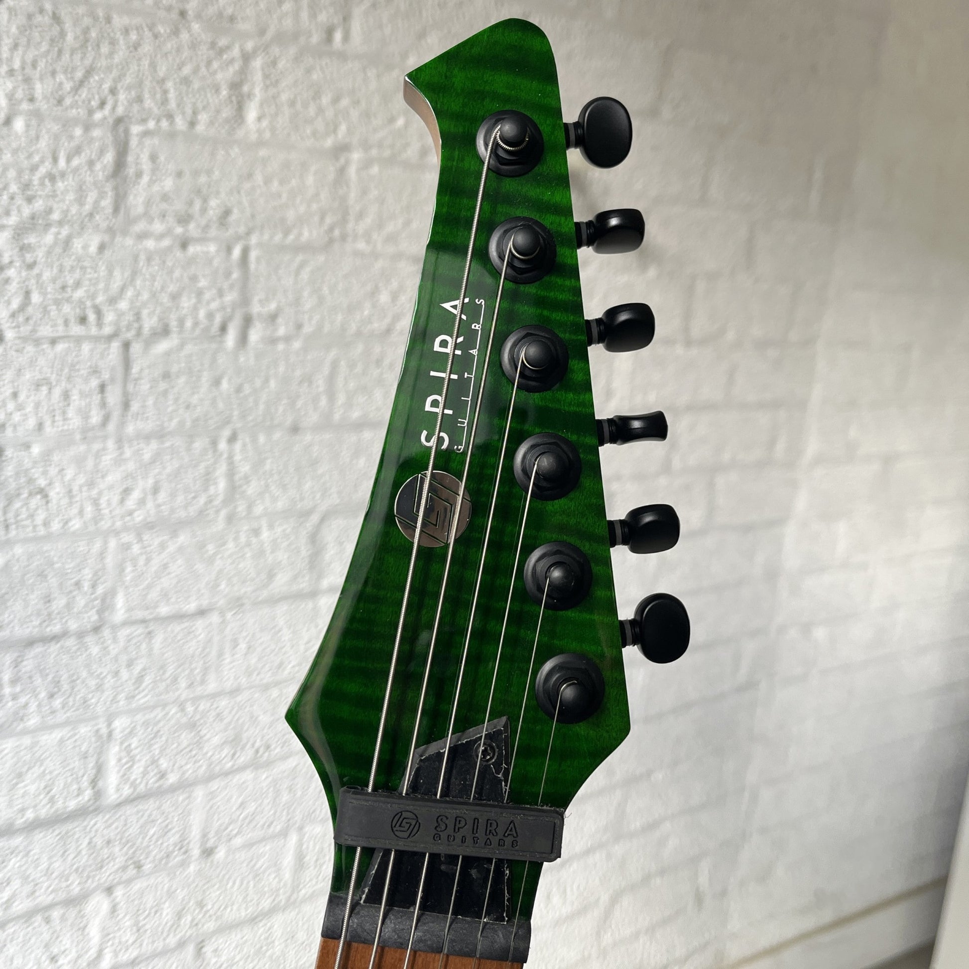 spira s-450 transparent green electric guitar headstock