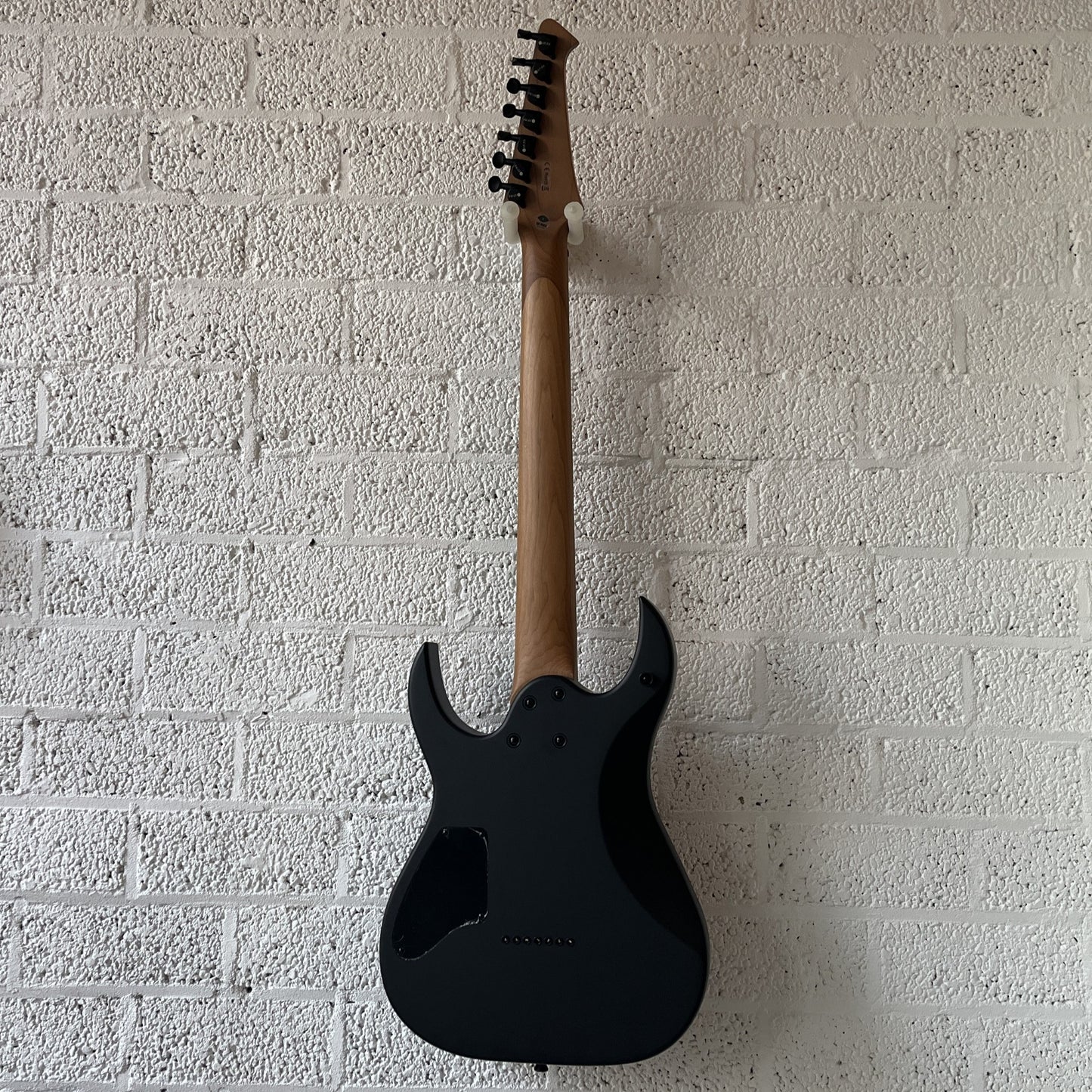spira s407 7-string satin black electric guitar back view