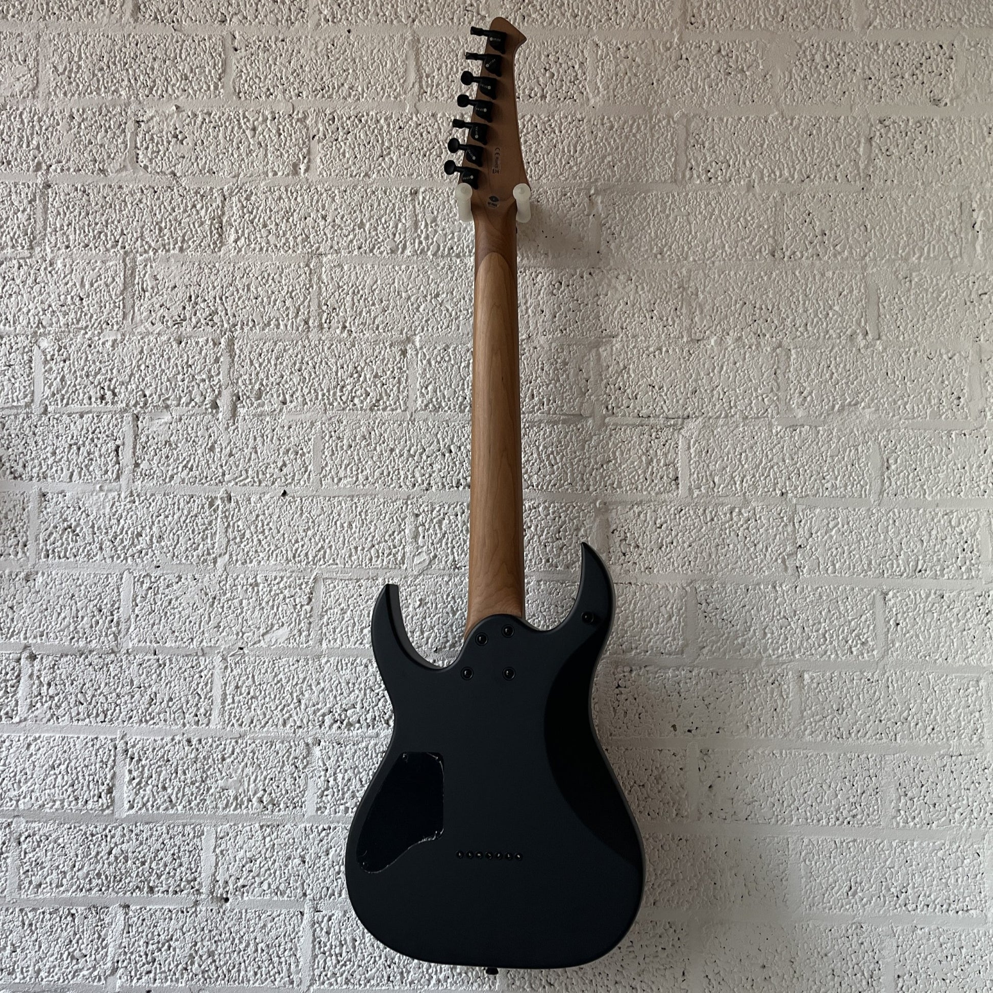 spira s407 7-string satin black electric guitar back view